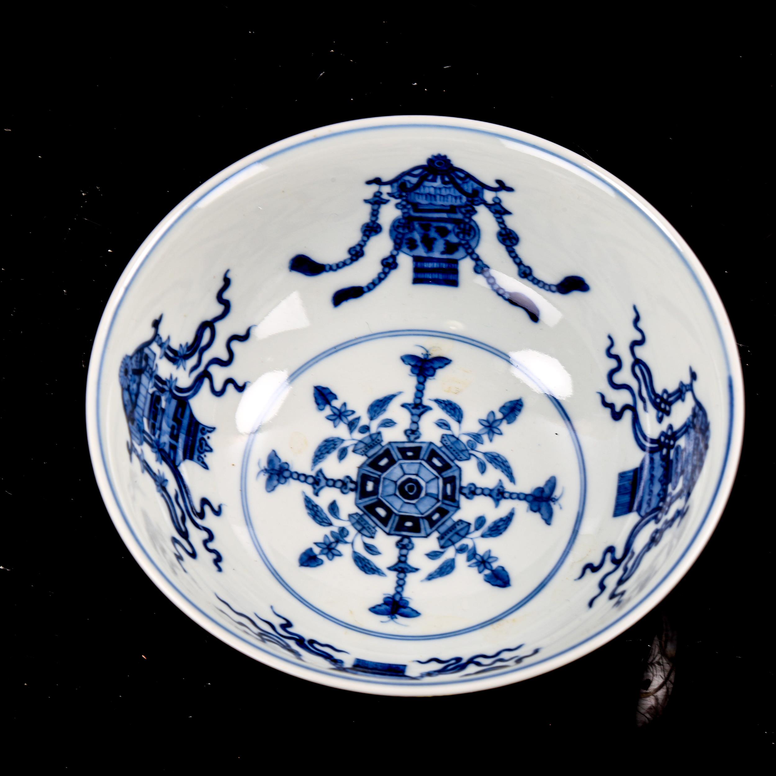 A Chinese porcelain bowl, with painted enamel panels, in iron red surround and blue painted - Image 2 of 3