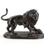 Victorian bronze patinated spelter sculpture, lion with a snake, length 21cm