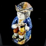 A 19th century Staffordshire Pearlware seated Toby jug, height 26cm, impressed crown mark under base