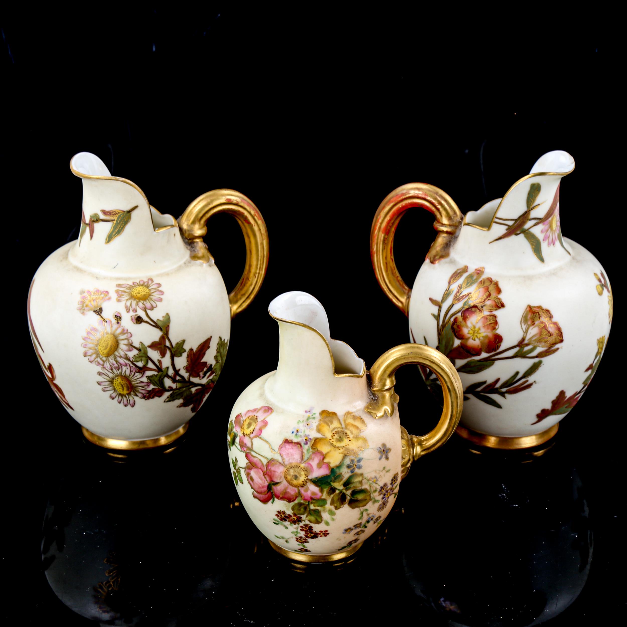 3 Royal Worcester flat-back jugs, with hand painted and gilded decoration