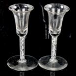 2 similar 18th century cordial glasses, with milk twist stems, height 15.5cm
