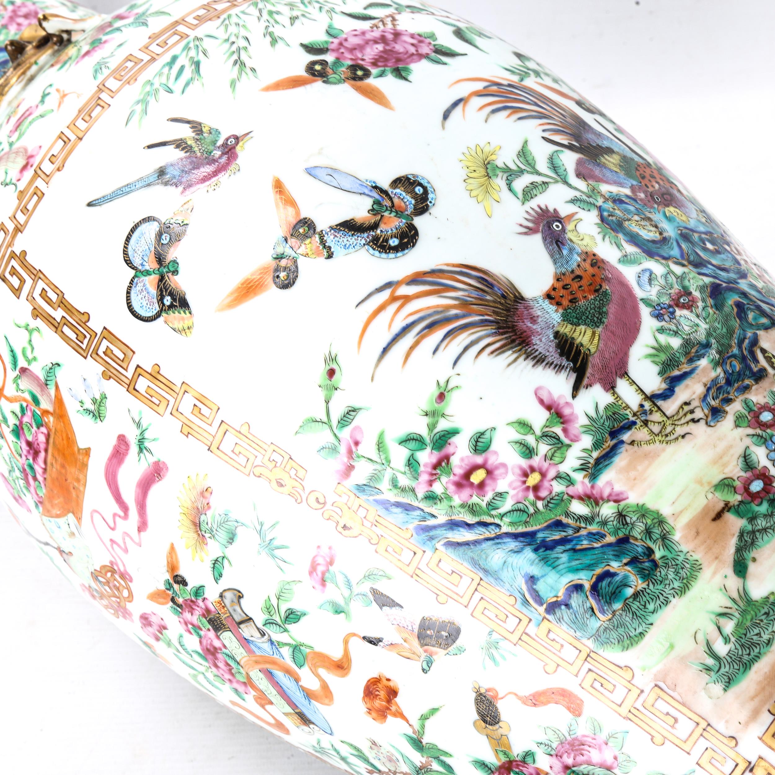 A pair of Chinese 19th century famille rose porcelain vases, with dragon and bird figures to the - Image 3 of 19