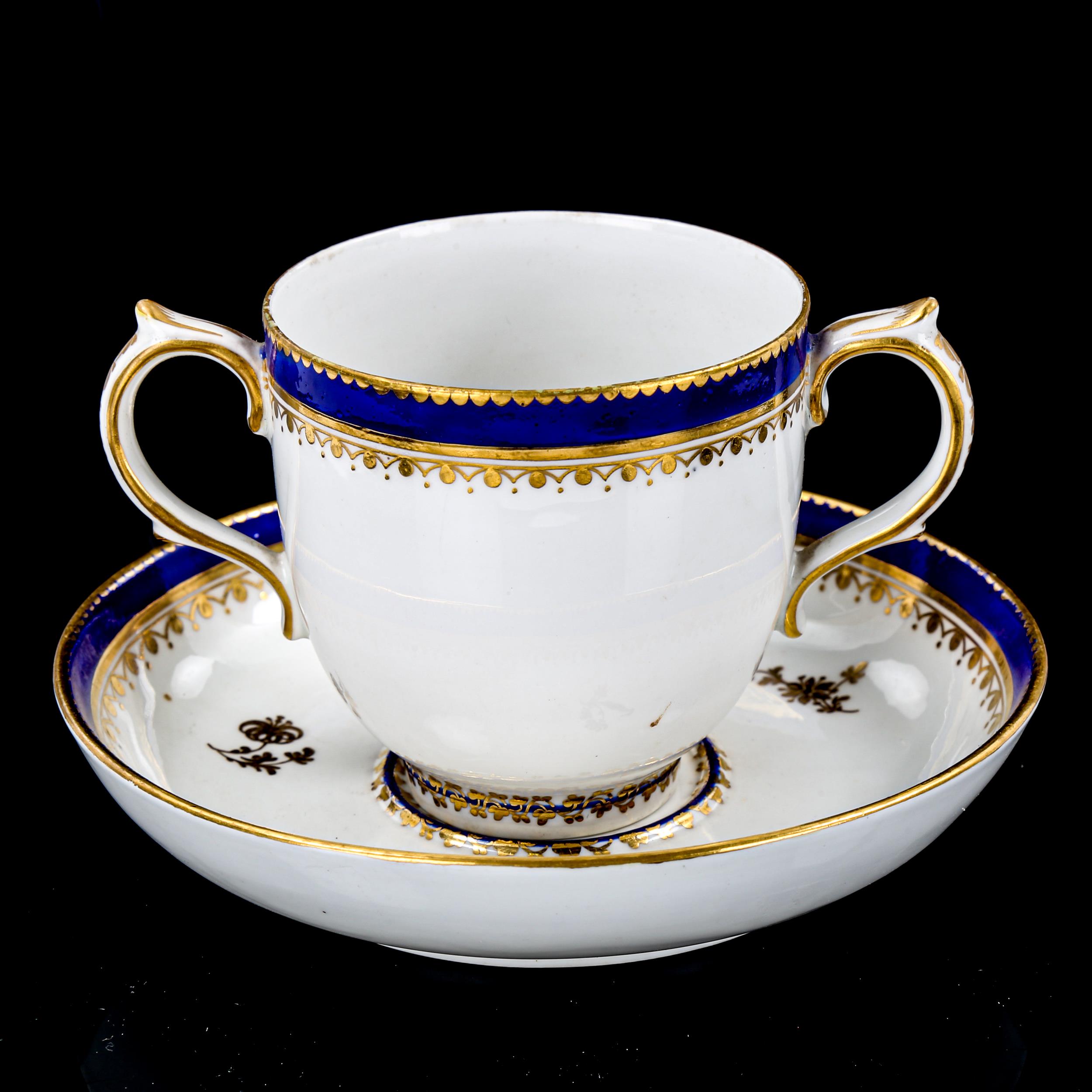 Crown Derby 2-handled cup and saucer, with blue and gilt decoration