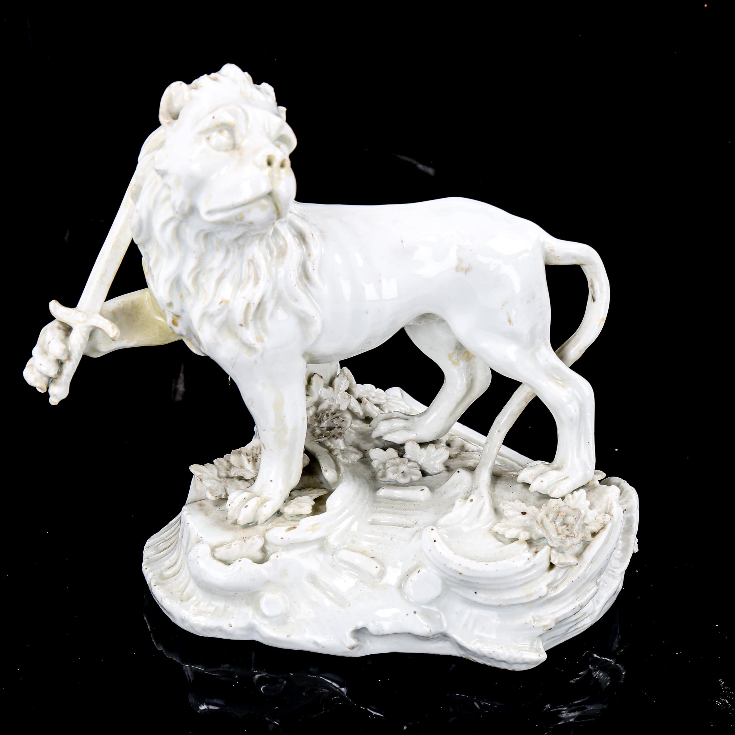 A Continental white glaze porcelain figure of a heraldic lion holding a sword, height 13cm, and a - Image 2 of 3