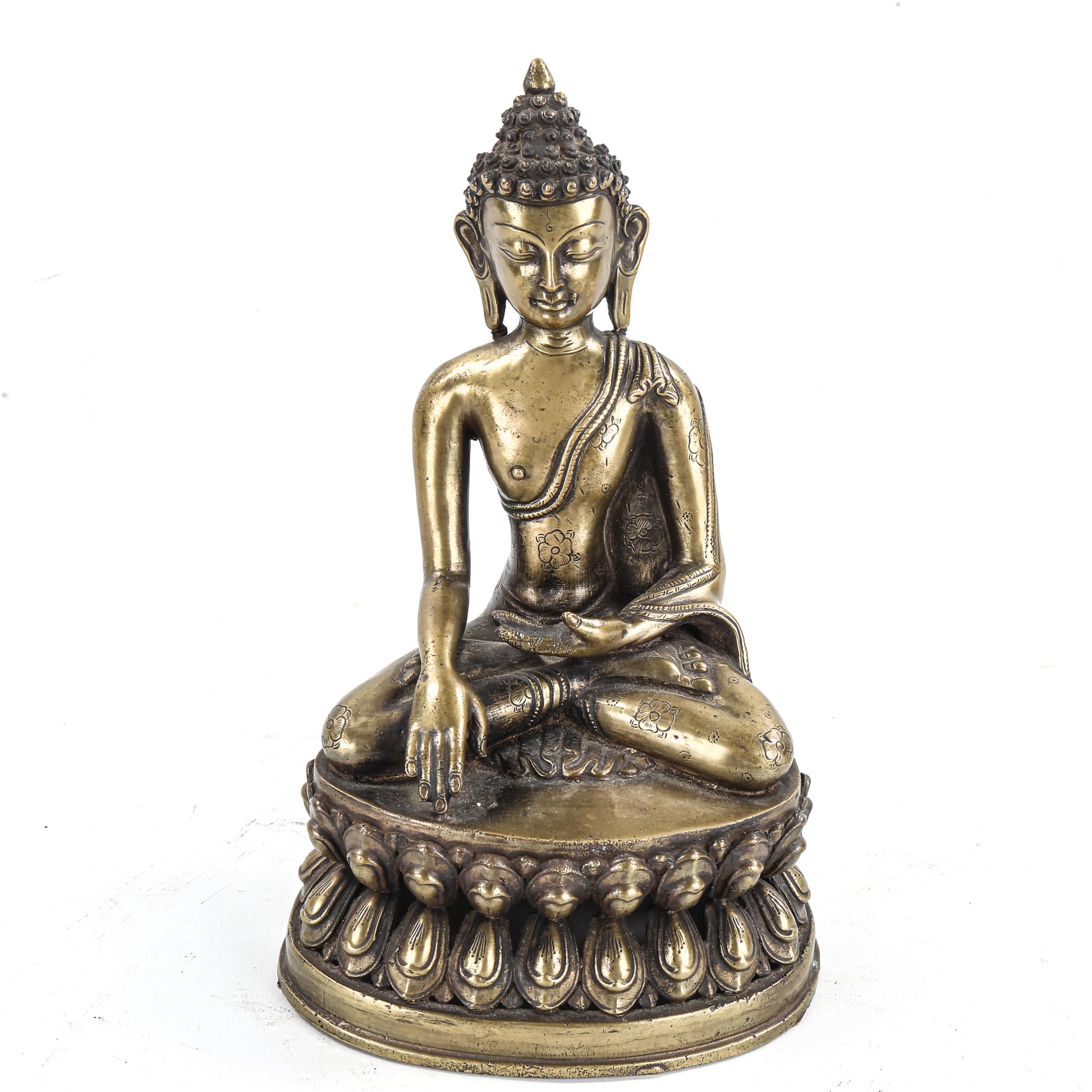 A Chinese gilt-bronze seated Buddha, height 24cm