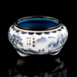 A small Chinese enamel brush pot, with painted landscape scenes and text, diameter 7.5cm