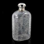 An Antique Continental handblown etched glass spirit bottle, a Continental silver top with