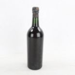 A bottle of Warres 1966 Vintage Port level to low neck