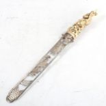 A fine quality ivory and silver paper knife, the handle decorated in high relief with monkeys and