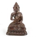 An Oriental patinated bronze seated Buddha, height 16cm