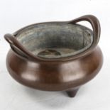 A Chinese patinated bronze incense burner, impressed seal mark under base, diameter 23cm