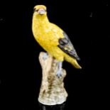 A German porcelain figure of a yellow bird, blue under-glaze mark, height 21cm