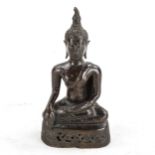An Oriental patinated bronze seated Buddha, height 17cm