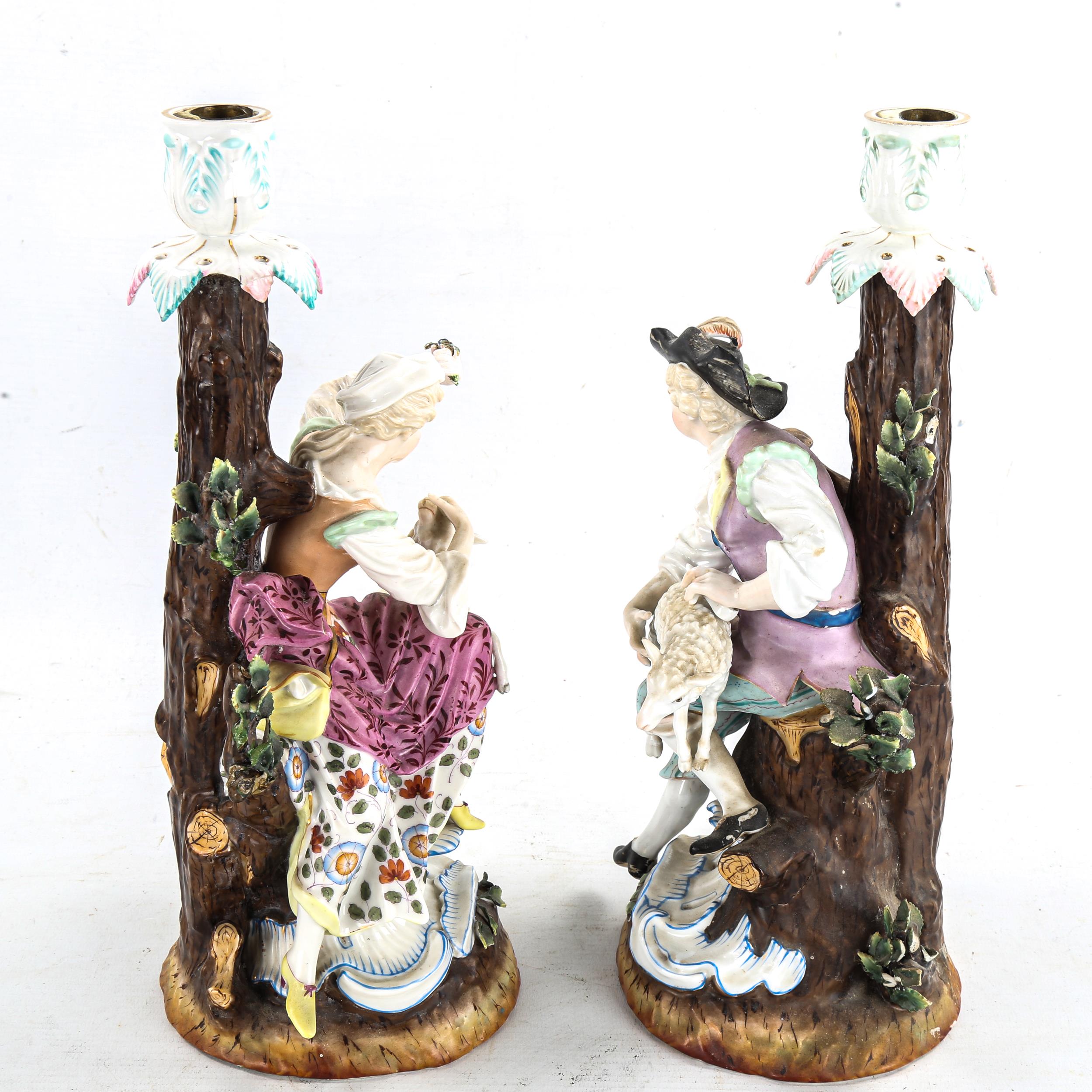 A pair of German porcelain candlesticks, surmounted by shepherd and shepherdess figures, Augustus - Image 2 of 3