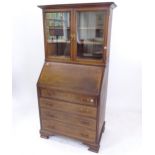 An Edwardian mahogany and satinwood-banded 2-section bureau bookcase, W83cm, H162cm, D48cm