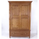 A modern pine 2-door wardrobe, with drawer-fitted base, W125cm, H200cm, D64cm