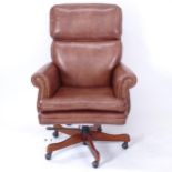 A studded brown leather swivel office chair, by Seven Seas Seating, (WITH THE OPTION TO PURCHASE THE