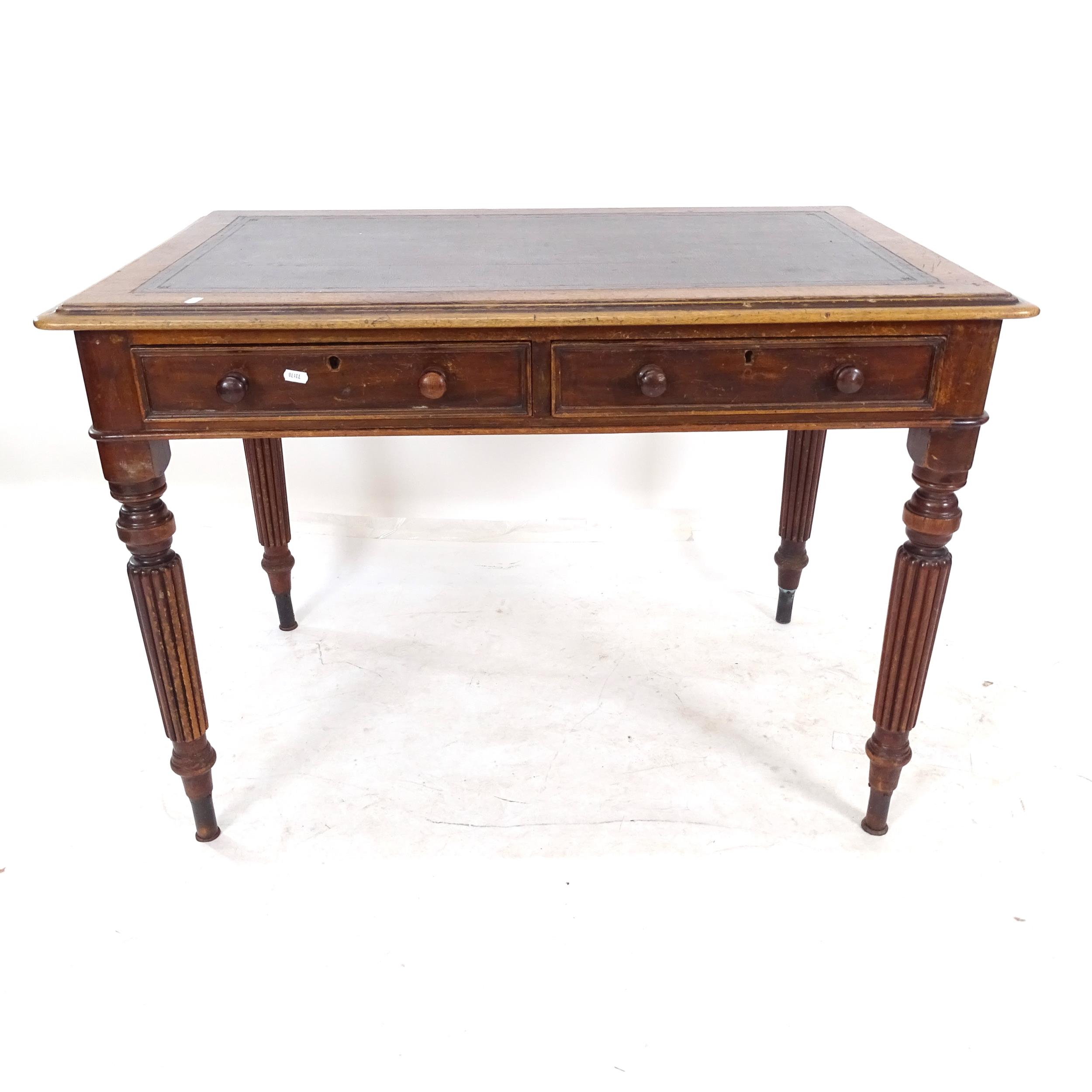 A Victorian mahogany writing desk, with 2 frieze drawers, raised on fluted legs, W107cm, H75cm,