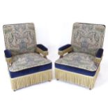 A pair of Edwardian tapestry-upholstered hall armchairs