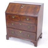 An Antique mahogany and yew wood bureau, with fitted interior and 4 drawers, W77cm, H89cm, D45cm