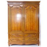 A modern carved oak 2-door wardrobe, with drawer-fitted base, W147cm, H230cm, D61cm (A/F) (WITH