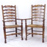 A pair of oak and elm ladder-back elbow chairs, with rush seats