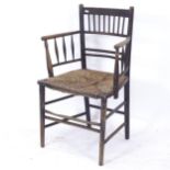 An Antique bow-arm Sussex chair with rush seat