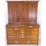 A 19th century pitch pine 2-section church cupboard, top having 3 panelled cupboard doors and