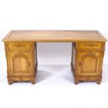 A modern carved oak twin-pedestal writing desk, with fitted drawers and cupboards, L161cm, H79cm,