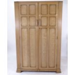 A 1930s Heals Cotswold School Limed Oak 2-door Wardrobe, W120cm, H183cm, D47cm