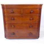 A 19th century mahogany bow-front chest of 2 short and 3 long drawers, with reeded canted corners,