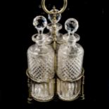 A set of 3 oval cut-glass decanters in original electroplate stand, overall height 35cm