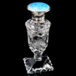 A cut-glass silver and blue enamel topped perfume bottle, Birmingham 1929, height 9.5cm