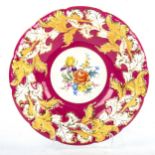 A Meissen porcelain table centre bowl, hand painted botanical centre panel in red and gilt border,