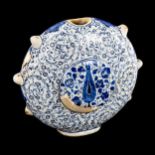 A Turkish pottery moon-shaped water flask, with painted blue and white decoration, height 19cm