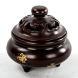 A Chinese patinated and gilded bronze incense burner and cover, diameter 9cm, impress marks under