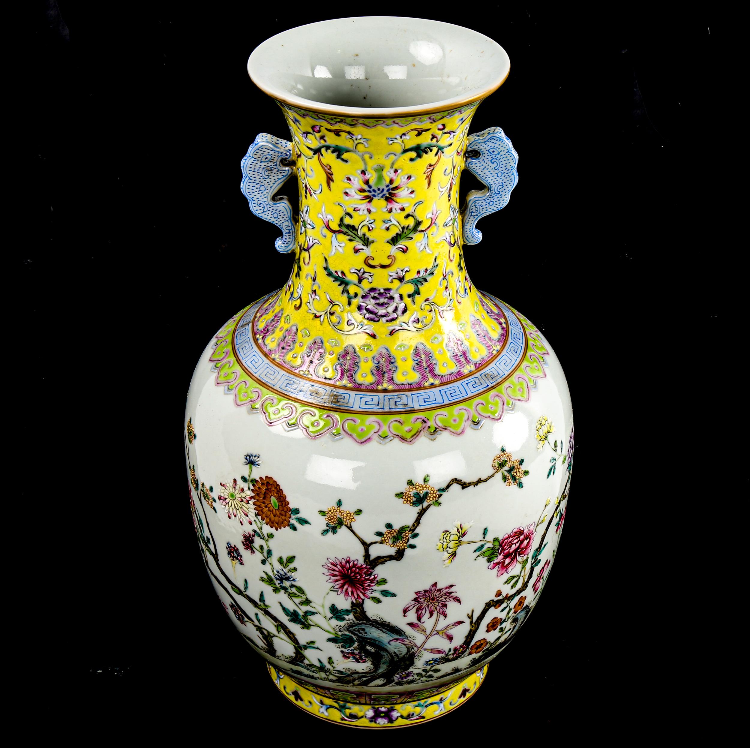 A Chinese white glaze porcelain vase, finely painted enamel flowers with yellow ground neck, seal