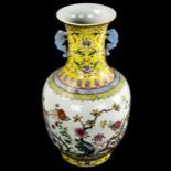 A Chinese white glaze porcelain vase, finely painted enamel flowers with yellow ground neck, seal