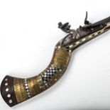 Antique Middle Eastern flintlock rifle, with inlaid brass and mother-of-pearl marquetry