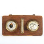 A wall-hanging combination aircraft clock/barometer/thermometer mounted on wooden plaque, clock dial