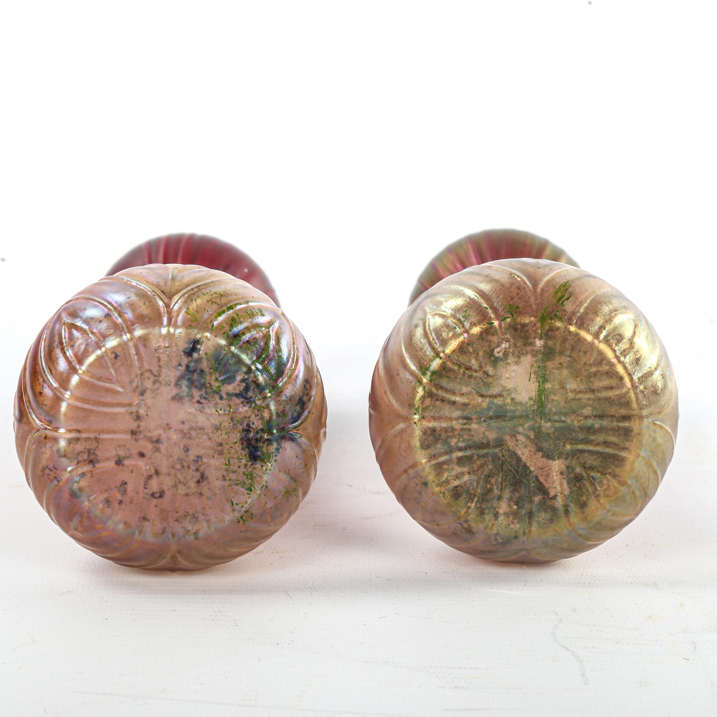 A pair of Loetz style iridescent red glass vases with moulded decoration, hallmarked silver rims, - Image 2 of 3