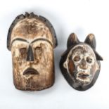 2 African Tribal carved and painted wood masks, height 34cm and 27cm