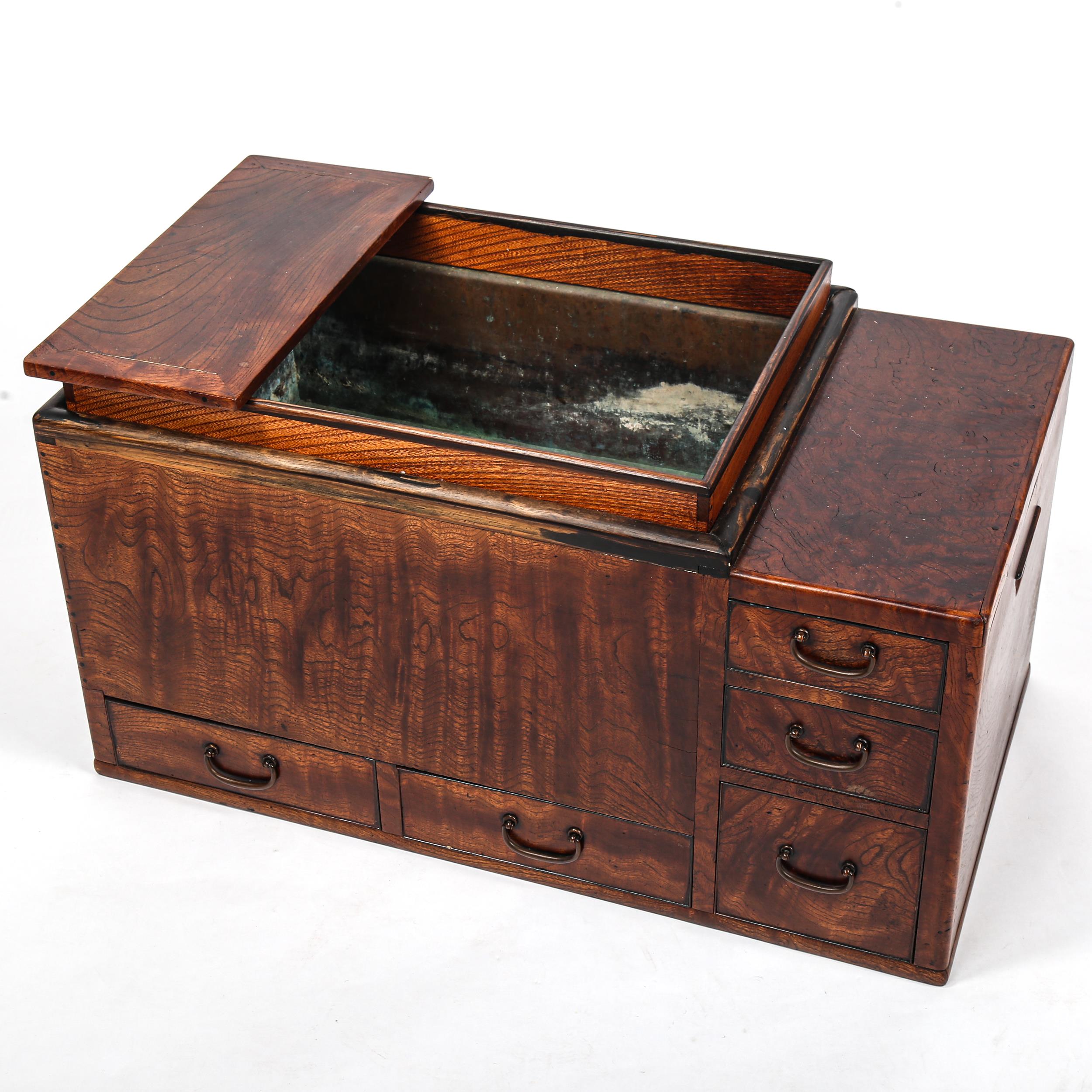 A Japanese hibachi cabinet, with copper liner and small drawers below, length 71cm Very good