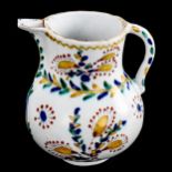 A Turkish Kutahya pottery coffee pot, with painted decoration, height 12cm A few tiny glaze chips