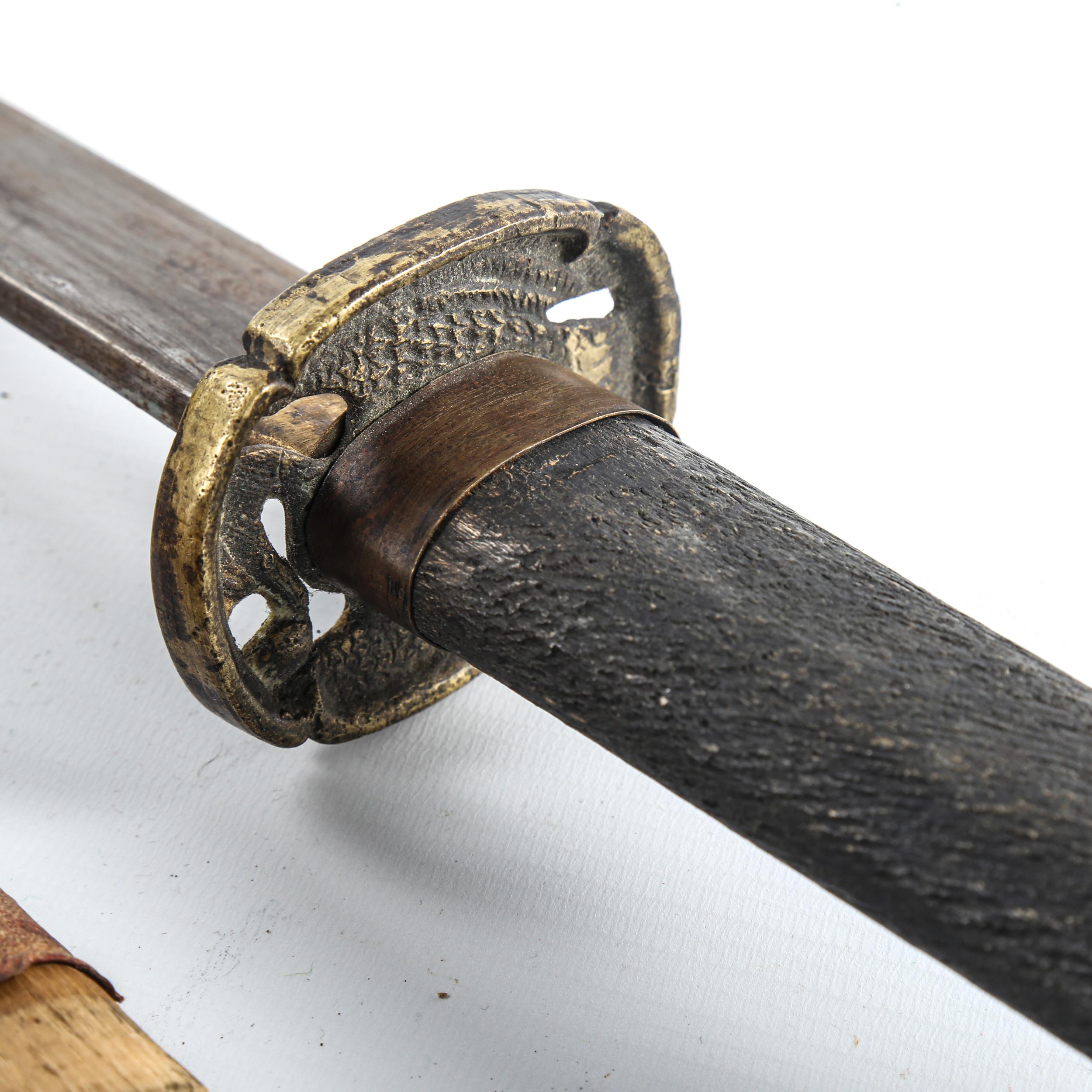 A Japanese sword, probably mid-20th century, with cast and pierced brass tsuba and leather-bound - Image 3 of 3