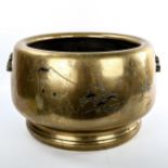 A large Japanese bronze jardiniere, engraved mountain landscapes and cast handles, diameter 35cm,