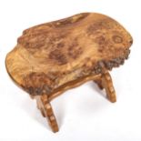 In the manner of Alan Grainger (The Acorn Man), a small burr-elm low table on stretcher base, length
