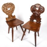 A pair of German Brettstuhl / Tyrolean chairs by Hans Thoma of Bernau, with relief carved backs