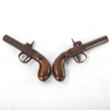 2 19th century percussion overcoat pistols, with walnut grips, overall length 16.5cm