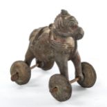 A Middle Eastern bronze toy roll-along horse on brass wheels, length 13cm Good condition